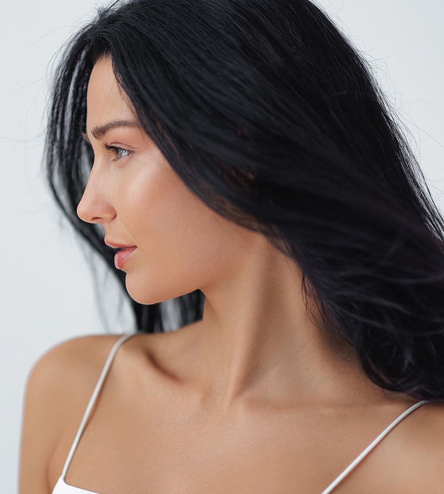 Profile of a woman with flowing black hair