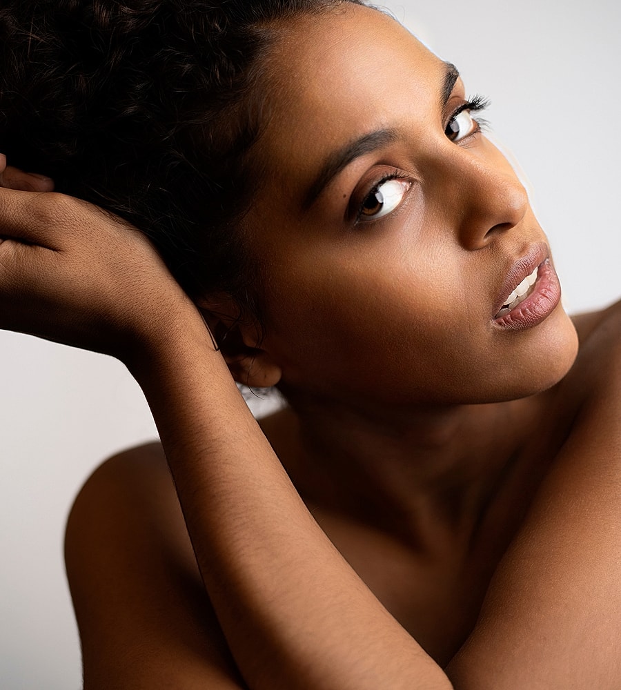 Portrait of a woman with curly hair.