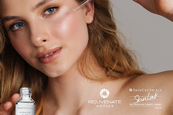 Woman applying skincare product for hydration.